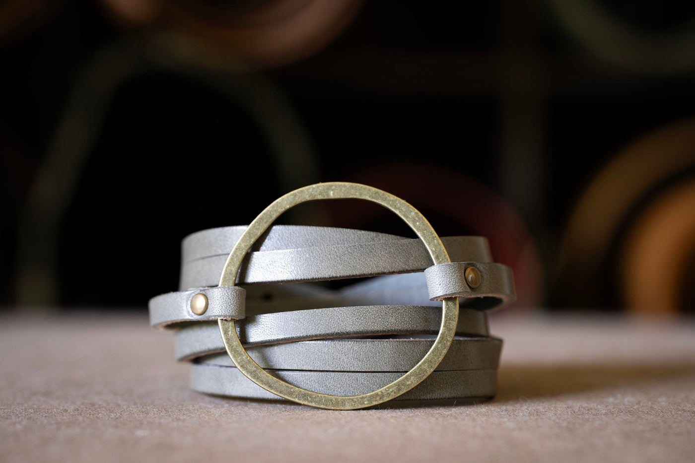 Womens Handmade Leather Hoop Bracelet Triple wrap cut to look like six strips for a stacking bracelet look engrave inside and out perfect gift for her Gray leather with antique brass hardware hoop is approx. 2 inches wide adjustable closure